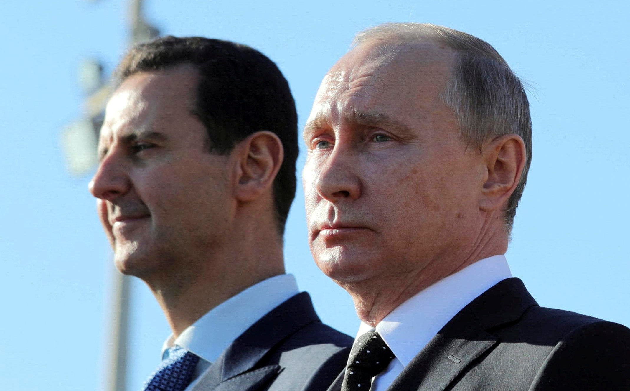 Russian President Vladimir Putin (R) and Syrian President Bashar al-Assad visit the Hmeymim air base in Latakia Province, Syria December 11, 2017. Picture taken December 11, 2017. To match Special Report RUSSIA-FLIGHTS/ Sputnik/Mikhail Klimentyev/ via REUTERS/File Photo  ATTENTION EDITORS - THIS IMAGE WAS PROVIDED BY A THIRD PARTY. - RC1DE7734AA0