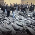 הסתתר חי בתוך שקי גופות במשך שלושה ימים | עדויות מטלטלות