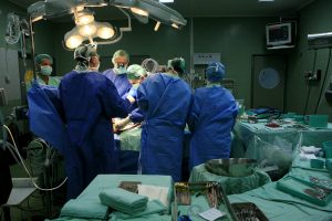 An Israeli medical staff of surgeons and nurses conduct open heart surgery in an Israeli hospital