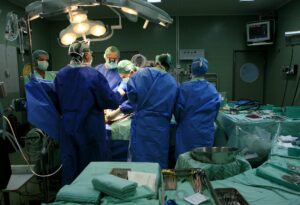 An Israeli medical staff of surgeons and nurses conduct open heart surgery in an Israeli hospital